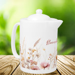 Wildflowers beige pink name quote teapot<br><div class="desc">Charming Wildflower Meadow Design,   featurring a delicate watercolor illustration of a wildflower meadow,  adorned with pink flowers,  beige straws,  and grass. This picturesque scene on a pristine white background adds a touch of natural beauty and tranquility to your kitchen. 

With the motivational quote:  Bloom with every brew.</div>