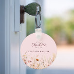 Wildflowers pink beige monogram keychain<br><div class="desc">Add a touch of personal charm to your daily routine with our Personalized Floral Keychain. Featuring a delightful pink background decorated with wildflowers from a summer meadow, this keychain is as beautiful as it is practical. Perfect for keeping your keys organized while adding a personal touch to your space. Beautiful...</div>