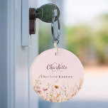 Wildflowers pink beige monogram name keychain<br><div class="desc">Add a touch of personal charm to your daily routine with our Personalized Floral Keychain. Featuring a delightful pink background decorated with wildflowers from a summer meadow, this keychain is as beautiful as it is practical. Perfect for keeping your keys organized while adding a personal touch to your space. Beautiful...</div>