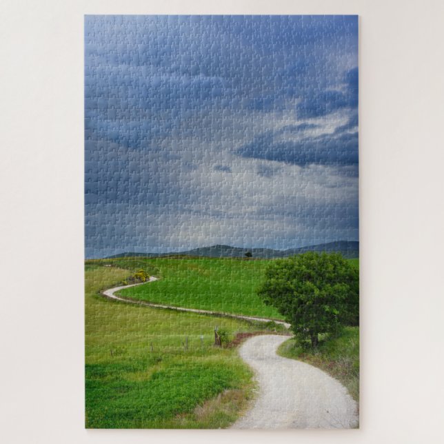 Winding road under a dark sky jigsaw puzzle (Vertical)