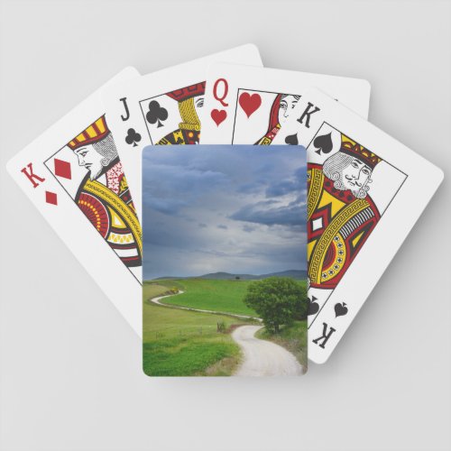 Winding road under a dark sky poker cards