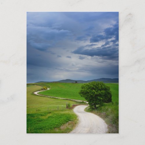 Winding road under a dark sky postcard