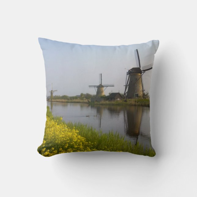 Windmills along the canal in Kinderdijk Throw Pillow (Front)