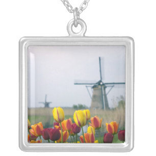 Windmills and tulips along the canal in silver plated necklace