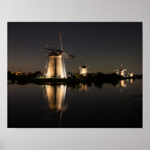 Windmills illuminated at night poster print