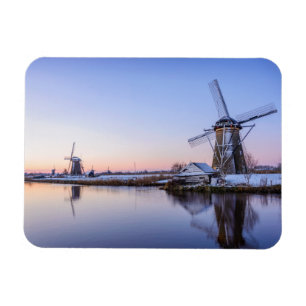 Windmills in winter during a sunrise rectangle magnet