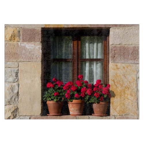 Window flower pots in village cutting board