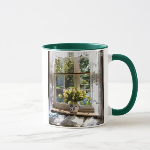Window with lace curtain and tulips mug