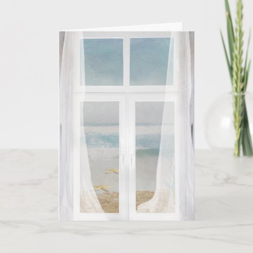 window with sheer curtain and ocean view card