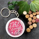 Wine a Little Laugh A Lot Keychain<br><div class="desc">Round button keychain features fun text "Wine a Little Laugh A Lot" on a red wine stain. Keychains make memorable gifts for family and friends or create for yourself.</div>