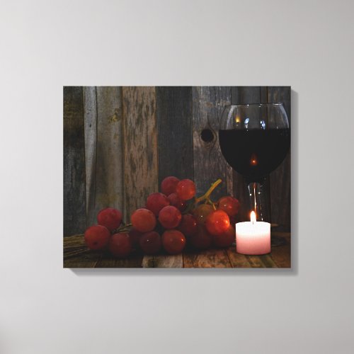 wine and grapes in candle glow canvas print