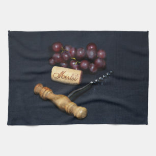 Wine bottle corks, corkscrew and grapes towel