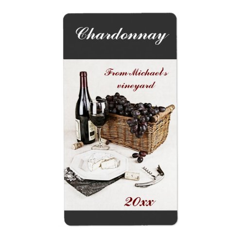 Wine bottle wine glass grapes and cheese label