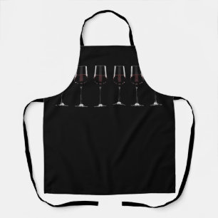Wine glasses with red wine on black apron
