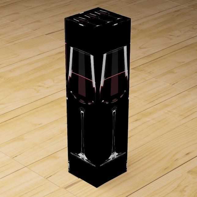 Wine glasses with red wine on black box (Front)