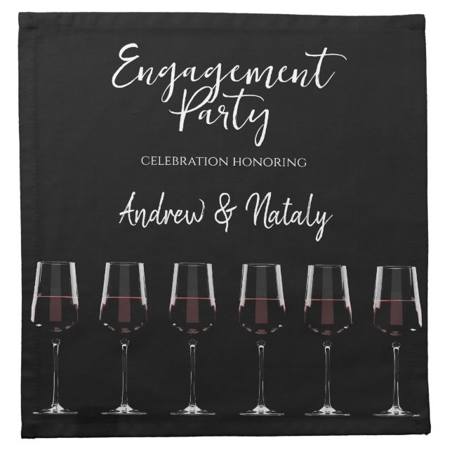 Wine glasses with red wine on black cloth napkin (Front)