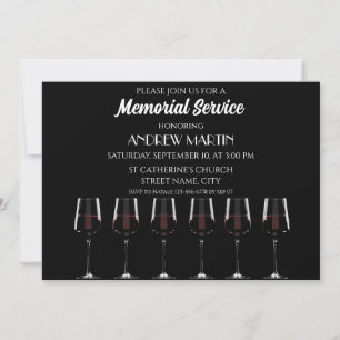 Wine glasses with red wine on black invitation