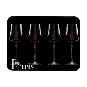 Wine glasses with red wine on black magnet