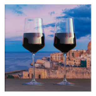 Wine glasses with view of sunset over Valletta Acrylic Print