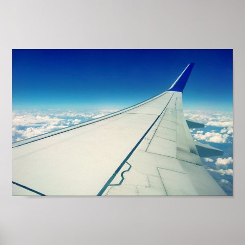 Wing view from airplane during flight poster