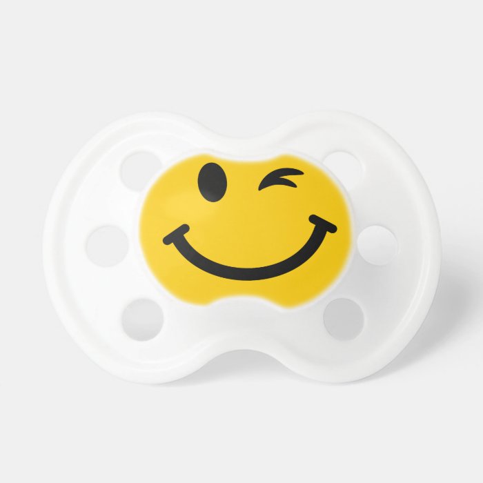 Winking smiley face pacifiers