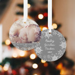 Winter Baby's First Christmas Snowflakes Photo Ornament<br><div class="desc">This sweet design features white and silver glitter snowflakes with space for one photo to commemorate Baby's 1st Christmas! The collection of coordinating products is available in our shop, zazzle.com/store/doodlelulu. Contact us if you need this design applied to a specific product to create your own unique matching item! Thank you...</div>