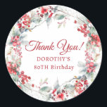 Winter Berry Wreath 80th Birthday Thank You Classic Round Sticker<br><div class="desc">A beautiful and elegant thank you favor sticker designed especially for an 80th birthday party. It features a watercolor wreath of red berries nestled in sage green foliage. Thank you is written in a timeless and classic script. Two lines below let you customize your thanks. This item is part of...</div>