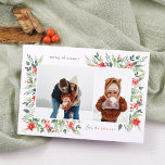 Winter Botanicals & Holly Merry Christmas 2 Photo Holiday Card<br><div class="desc">An elegant Christmas photo card design, featuring two custom photos: one landscape and one portrait, within a chic white frame. The frame is nestled inside the delicate watercolor foliage, creating a naturally organic layout. The foliage includes lush green leaves and bright red berries. There are red poinsettia flowers and pine...</div>