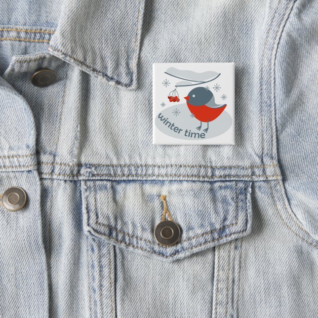 Winter bullfinch bird and red rowan berries button (In Situ)