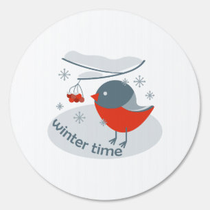Winter bullfinch bird and red rowan berries sign