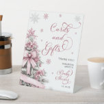 Winter Christmas Pink Baby Shower Cards Gifts Sign<br><div class="desc">Welcome guests with the Winter Christmas Pink Baby Shower Cards and Gifts Sign, featuring a soft pink design adorned with festive Christmas trees and delicate snowflakes. This stylish sign guides guests to the designated area for placing their cards and gifts, adding both functionality and charm to your winter-themed baby shower....</div>