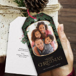 Winter Greenery Mistletoe Rounded Photo Christmas Gift Tags<br><div class="desc">This delightful Christmas gift tag showcases a vertical photo within a modern rounded frame,  accented with a mistletoe border. This black gift tag offers space for your favorite picture. Custom text,  on the backside,  allows you to add your own personal message,  or use the one shown.</div>