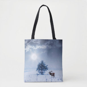 Winter landscape in blue color. Lonely tree and wi Tote Bag