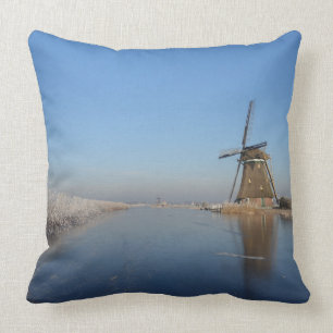 Winter landscape with windmill and ice throw pillow