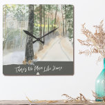 Winter Landscape Woodland Path No Place Like Home Square Wall Clock<br><div class="desc">Winter Landscape kitchen towel,  lettered with "There's No Place Like Home" in trendy script typography. This rustic country design has a watercolor scene of a tree-lined woodland path with warm glowing lanterns and a country cabin.</div>