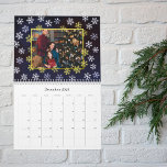 Winter Night Snowflakes Photo Christmas Calendar<br><div class="desc">Capture cherished memories while counting down the days with this romantic Christmas calendar. The design evokes a magical winter night, adorned with intricate white and light blue snowflakes set against a celestial background. The front showcases a personalized family portrait, framed in elegant gold color, offering a heartfelt touch. Above the...</div>