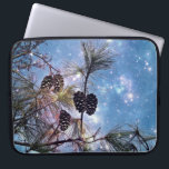 Winter Pine Cones under a starry night sky Laptop Sleeve<br><div class="desc">An ethereal magical image with an up close view of a pine tree and its branches with many pine cones grouped together. The night sky is a combination of enchanting blues and purples swirling together with ethereal luminous formations and bright twinkling stars shining up above.</div>