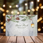 Winter Rustic Pine Trees Lantern Botanical Wedding Guest Book<br><div class="desc">Capture the cozy ambiance of your winter wedding with this enchanting guest book. Adorned with a rustic watercolor design featuring majestic pine trees, a warm lantern glow, and delicate botanical accents, this guest book provides a charming space for loved ones to share their well wishes and heartfelt messages. A treasured...</div>