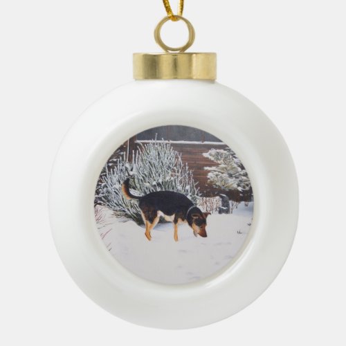 Winter snow scene with cute black and tan dog ceramic ball christmas ornament