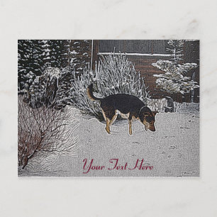 Winter snow scene with cute black and tan dog postcard