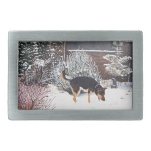Winter snow scene with cute black and tan dog rectangular belt buckle
