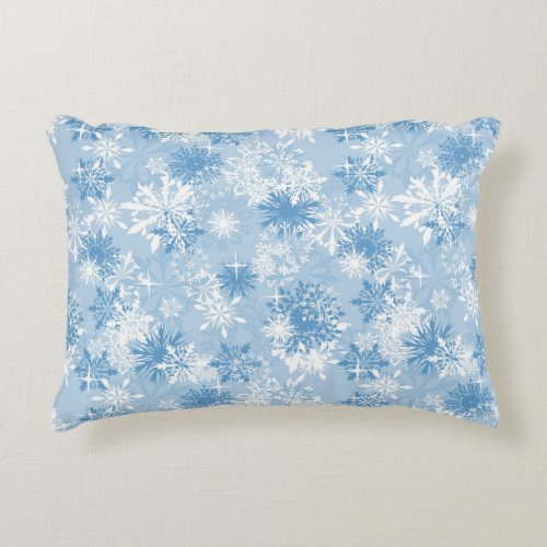 Winter snowflakes pattern on blue accent pillow