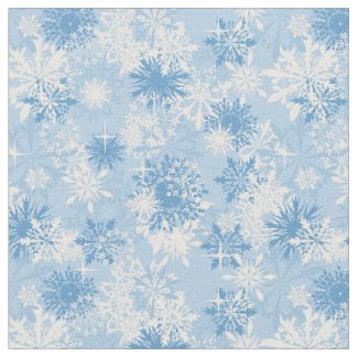 Winter snowflakes pattern on blue fabric