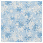 Winter snowflakes pattern on blue fabric