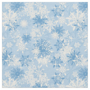 Winter snowflakes pattern on blue fabric