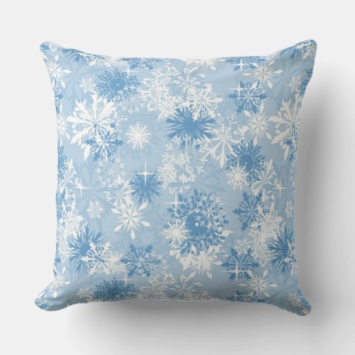 Winter snowflakes pattern on blue throw pillow