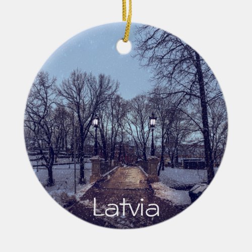 Winter snowy city park in the evening ceramic ornament