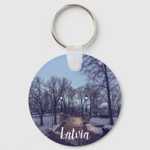 Winter snowy city park in the evening keychain