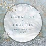 Winter Wedding Elegant First Snowflakes Classic Round Sticker<br><div class="desc">Featuring delicate snowflakes falling across your personalised names and special wedding date on a winter frost background. Designed by Thisisnotme©</div>