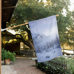 Winter wonderland, fog, spruce forest and mountain house flag